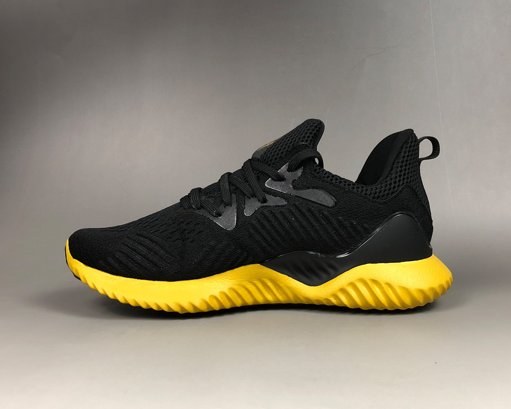 black and yellow adidas shoes