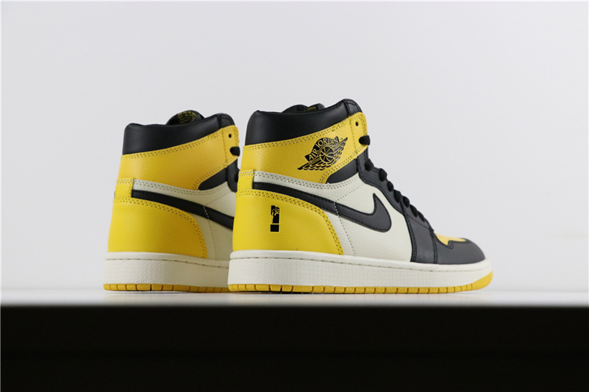 yellow black jordan 1