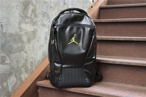 gold and black jordan backpack