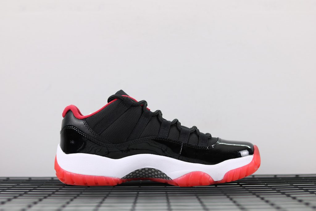 all black jordan 11 with red bottom