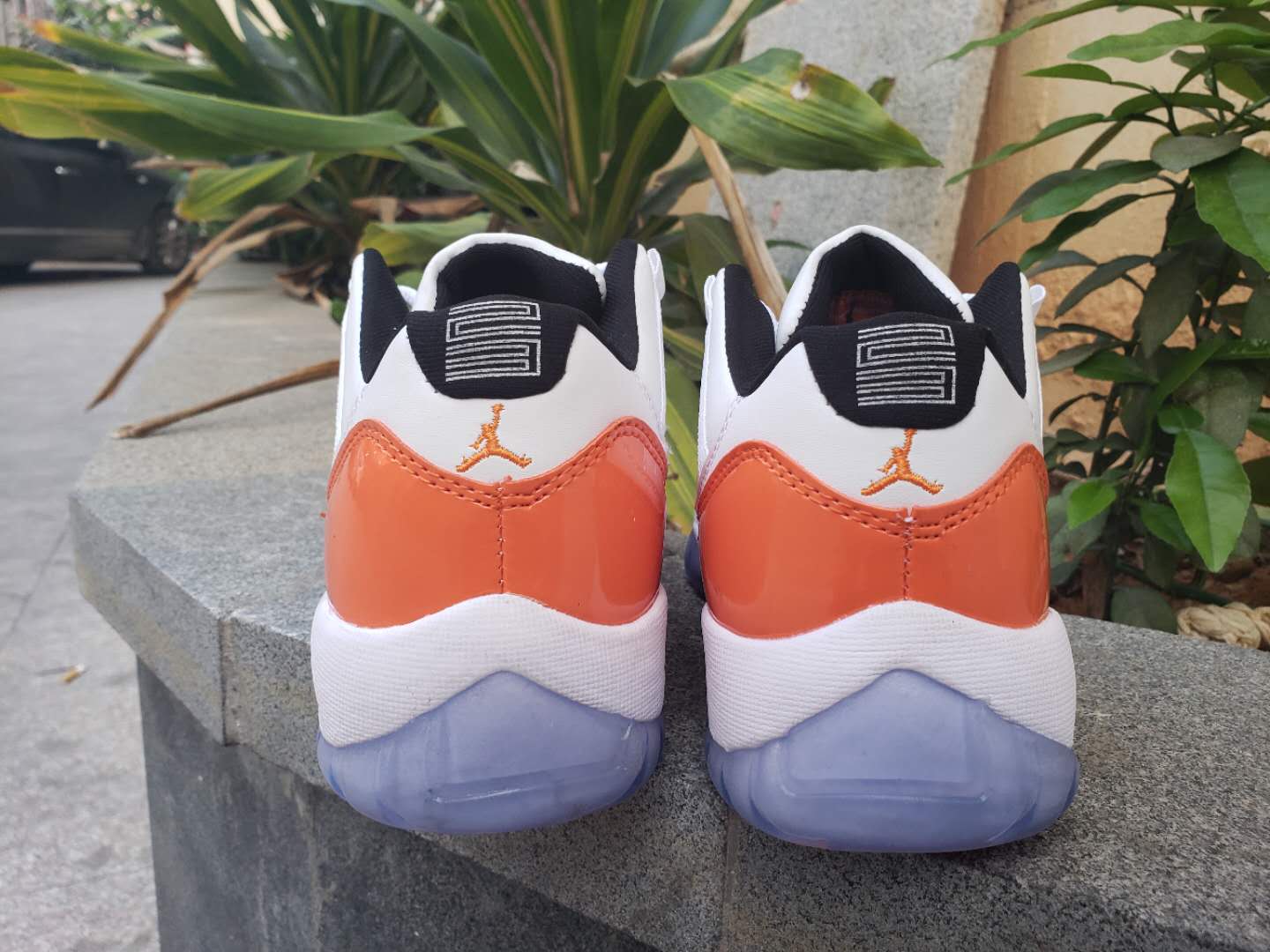 green and orange jordan 11