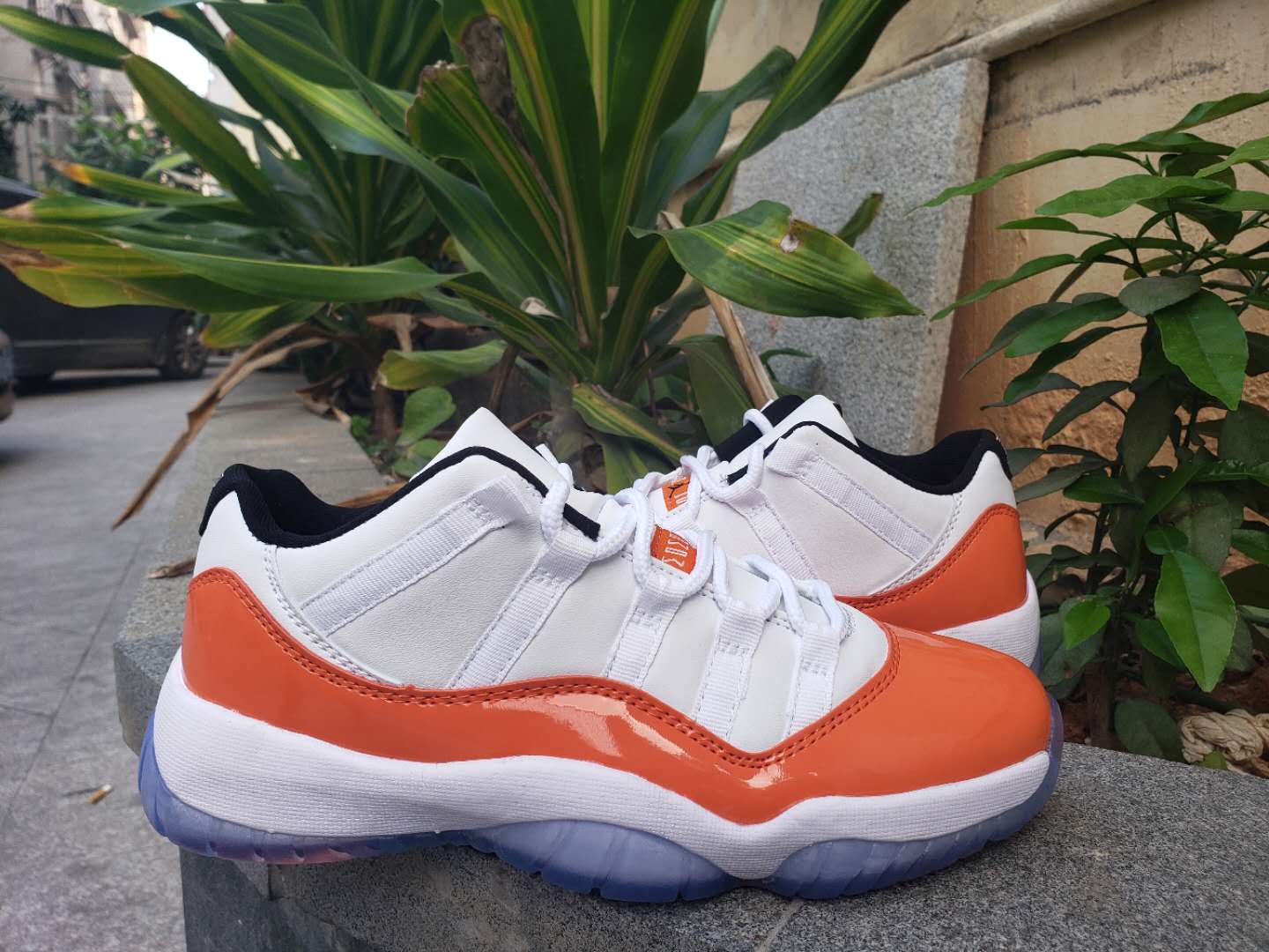 orange and white jordan 11s