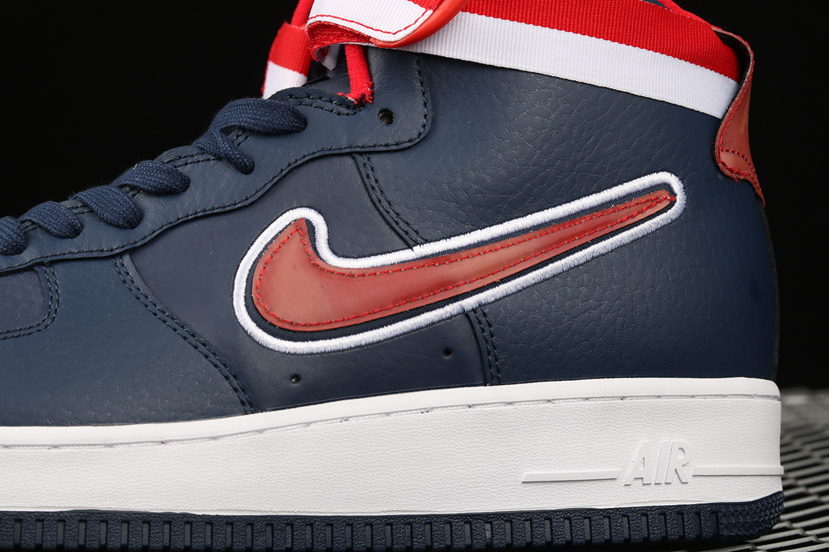 navy blue and orange air force ones