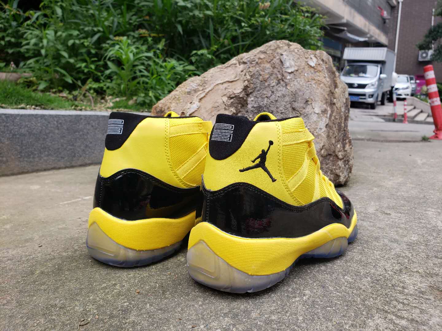 black and yellow jordan 11s