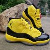 black and yellow 11 jordans