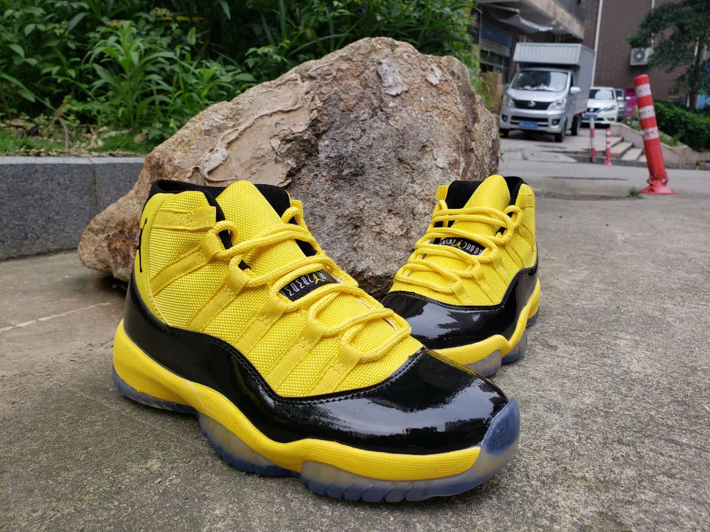 jordans 11 black and yellow