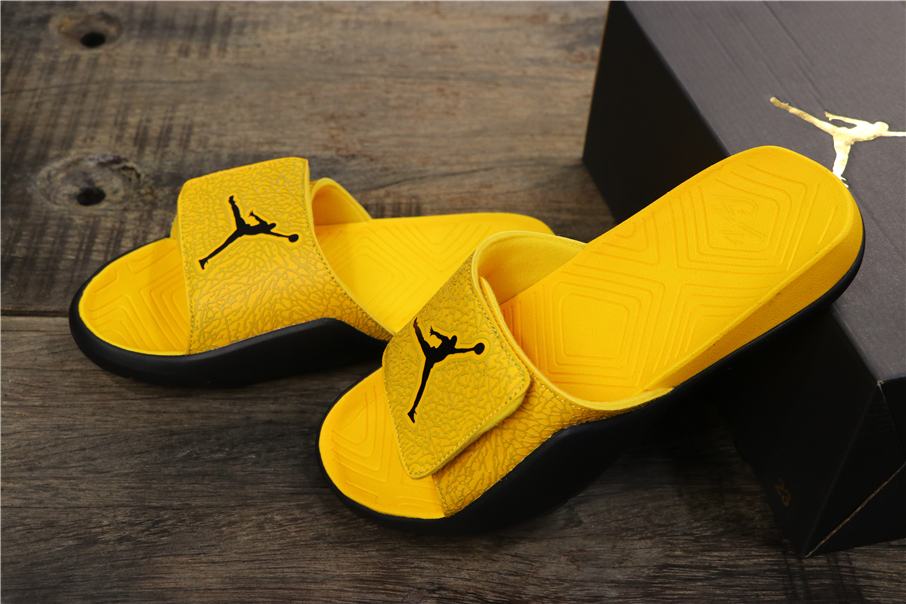 black and yellow jordan slides