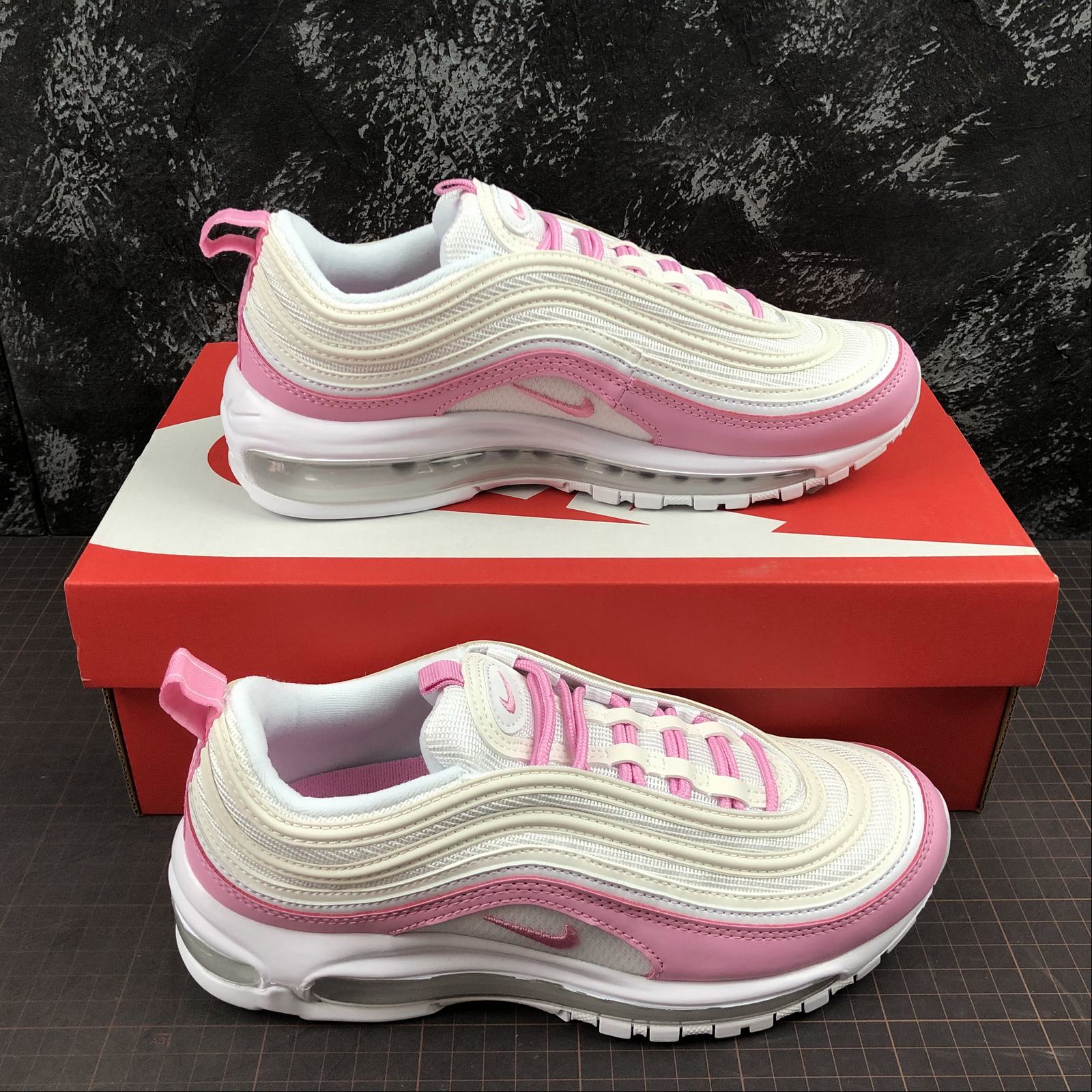 white and pink air max 97