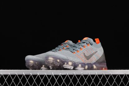 grey and orange vapormax