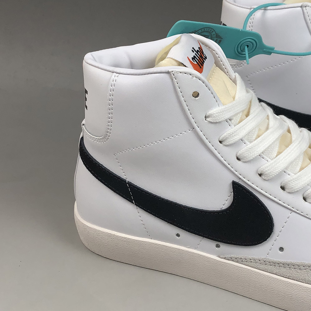 white nike blazer black swoosh