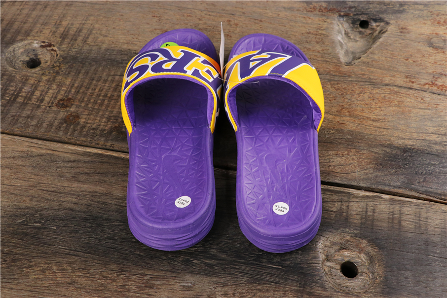 purple nike flip flops