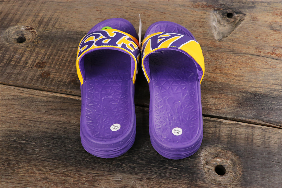 purple and gold nike slides