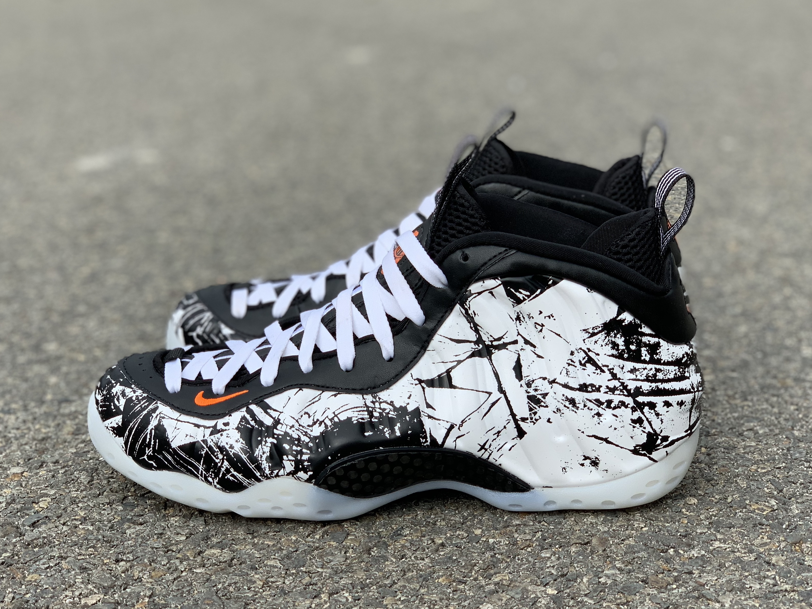 black white and orange foamposites