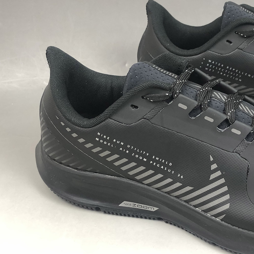 nike run black/gold air zoom pegasus 36 shield trainers