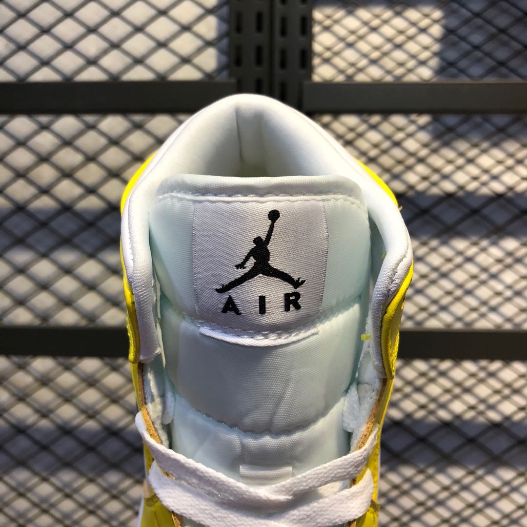 yellow and silver jordans