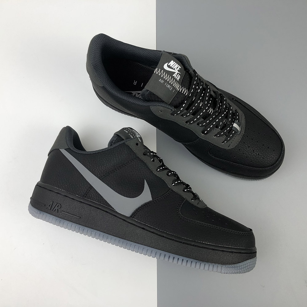 grey nike shoes with black swoosh