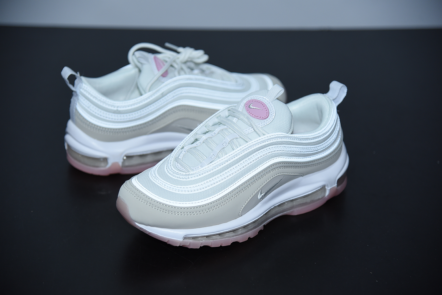 white and pink air max plus