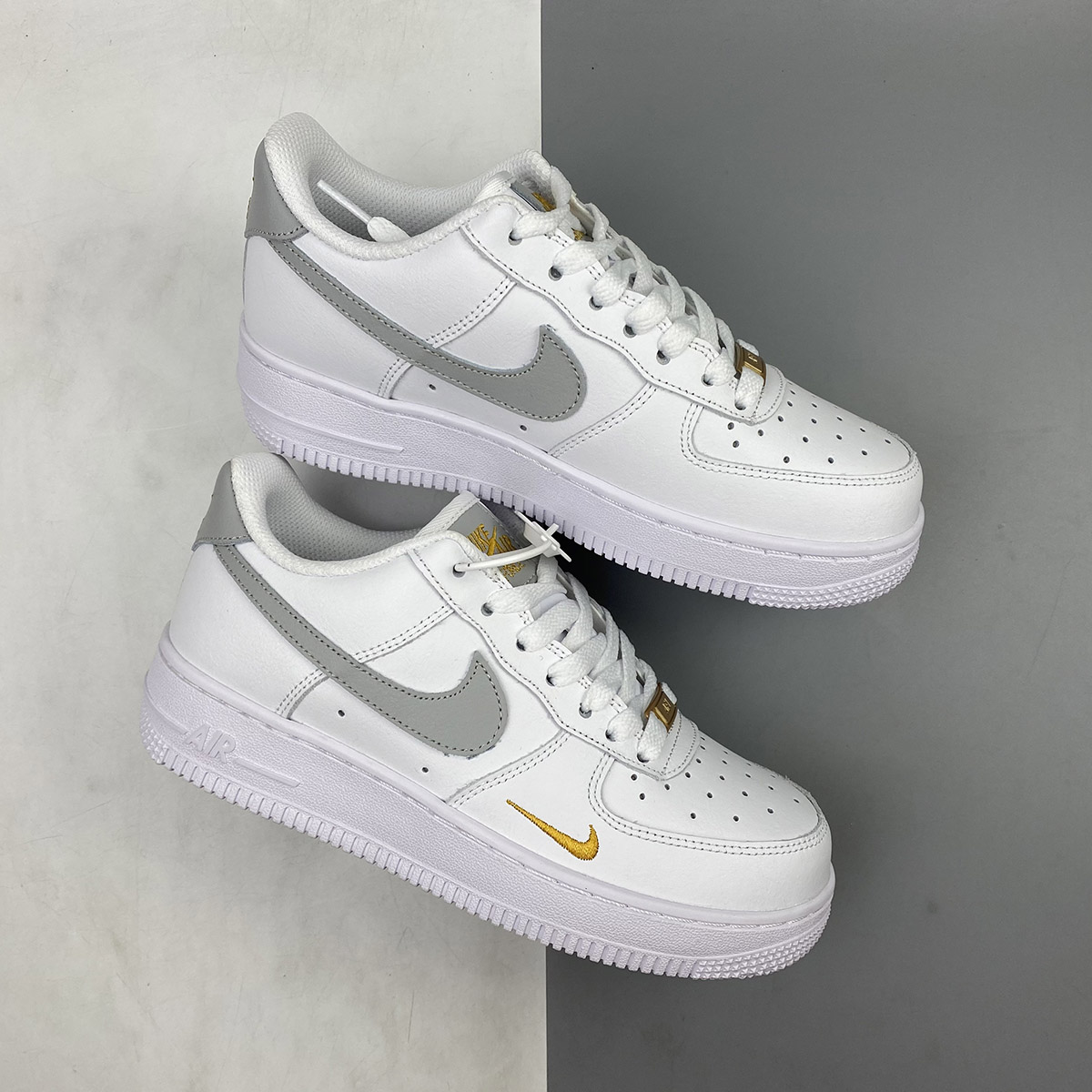 Nike-Air-Force-1-Low-White-With-Gold-Mini-Swooshes-1