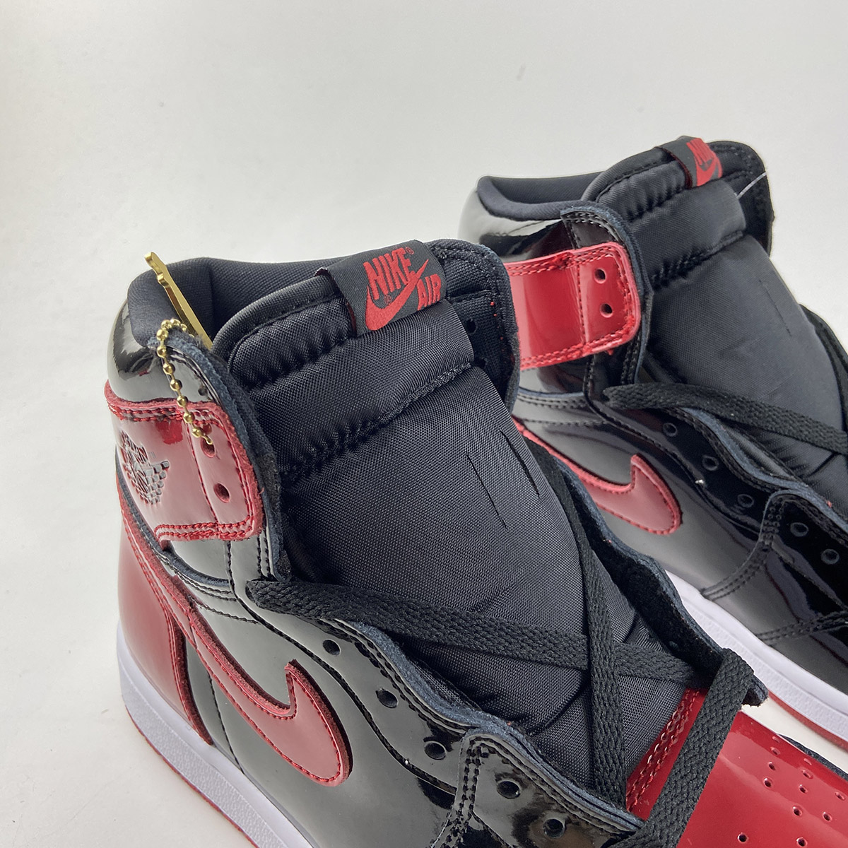 Air-Jordan-1-High-OG-Bred-Patent-Black-White-Varsity-Red-For-Sale-3