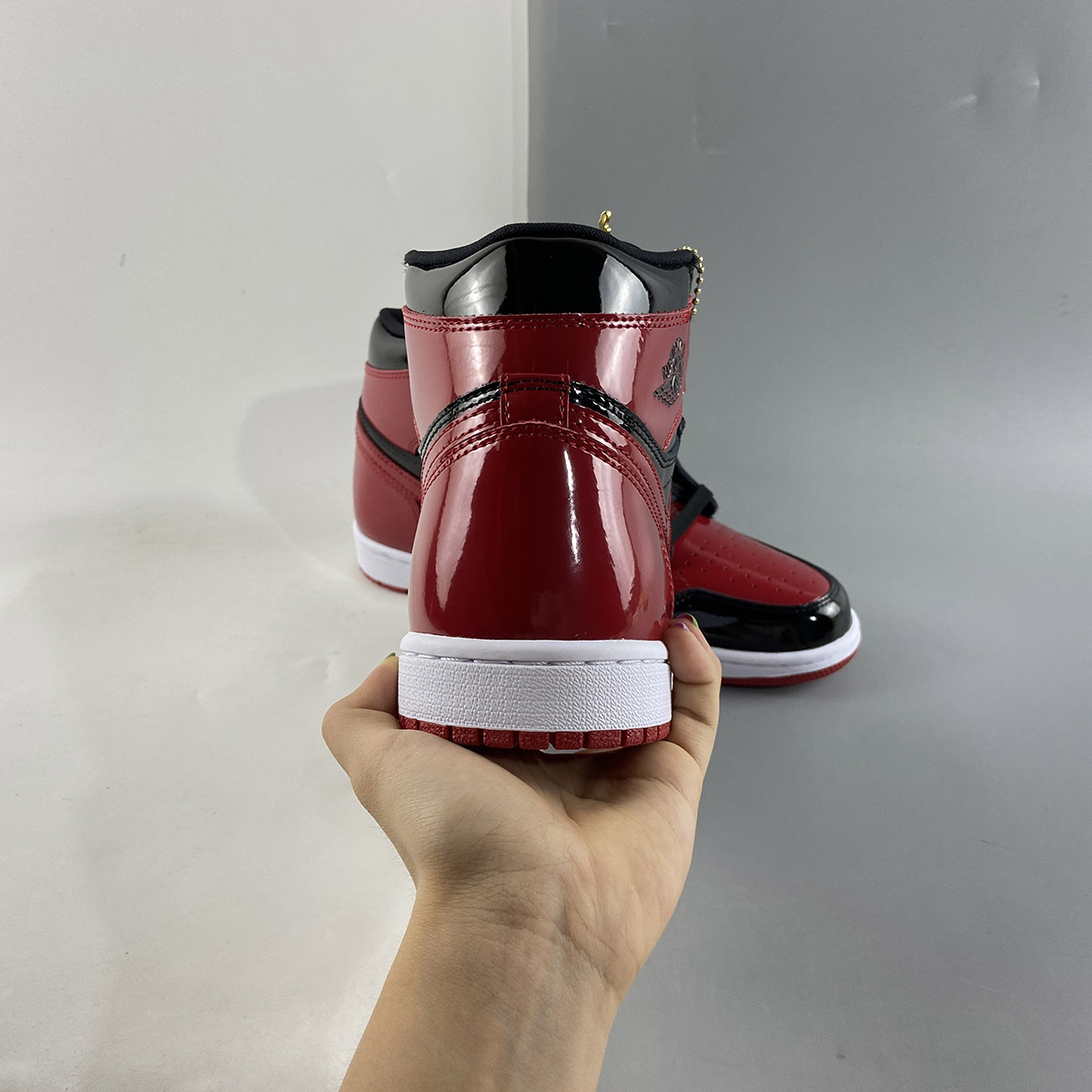 Air-Jordan-1-High-OG-Bred-Patent-Black-White-Varsity-Red-For-Sale-4